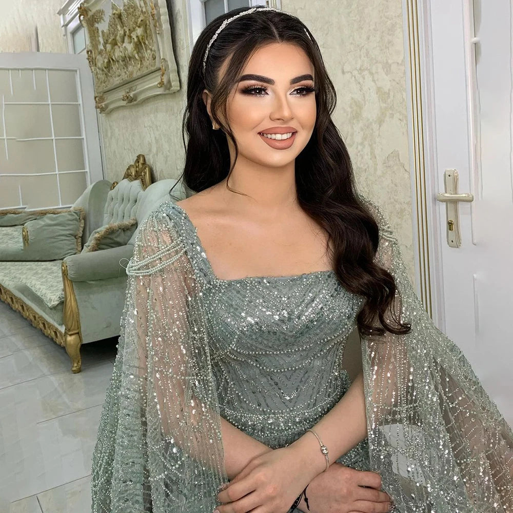 Serene Hill Arabic Turquoise Cape Sleeves Beaded Pearls and Floor Length Evening Gown Party Dress for Women 2024 LA72590 Turtleneck Neckline Stylish Serene Hill Arabic Turquoise Cape Sleeves Beaded Pearls and Floor Length Evening Gown Party Dress for Women 2024 LA72590 Turtleneck Neckline Stylish